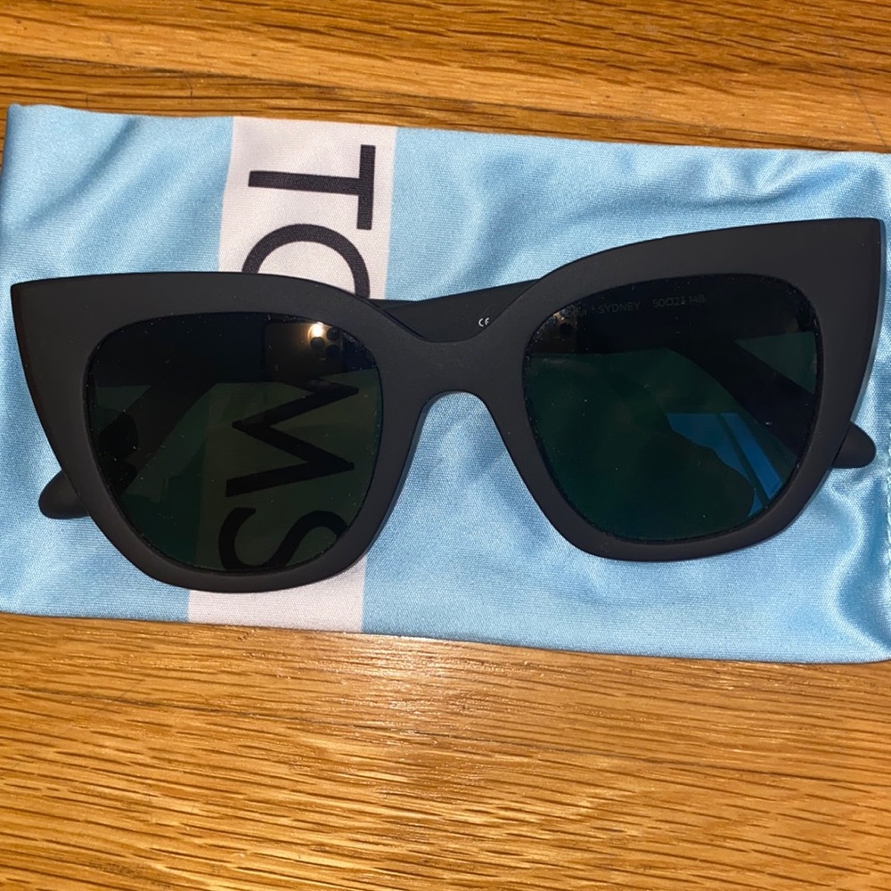 Tom’s sunglasses never worn like new